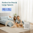 White air purifier on floor with front vent grille