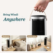 White tower fan with black grille and side handles, held up by the hand