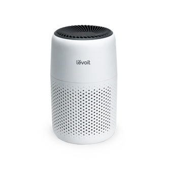 Levoit Core Mini air purifier, white cylinder with vented top and perforated sides