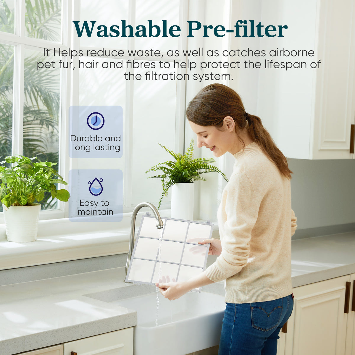 Person holding a washable pre-filter frame next to a white air purifier