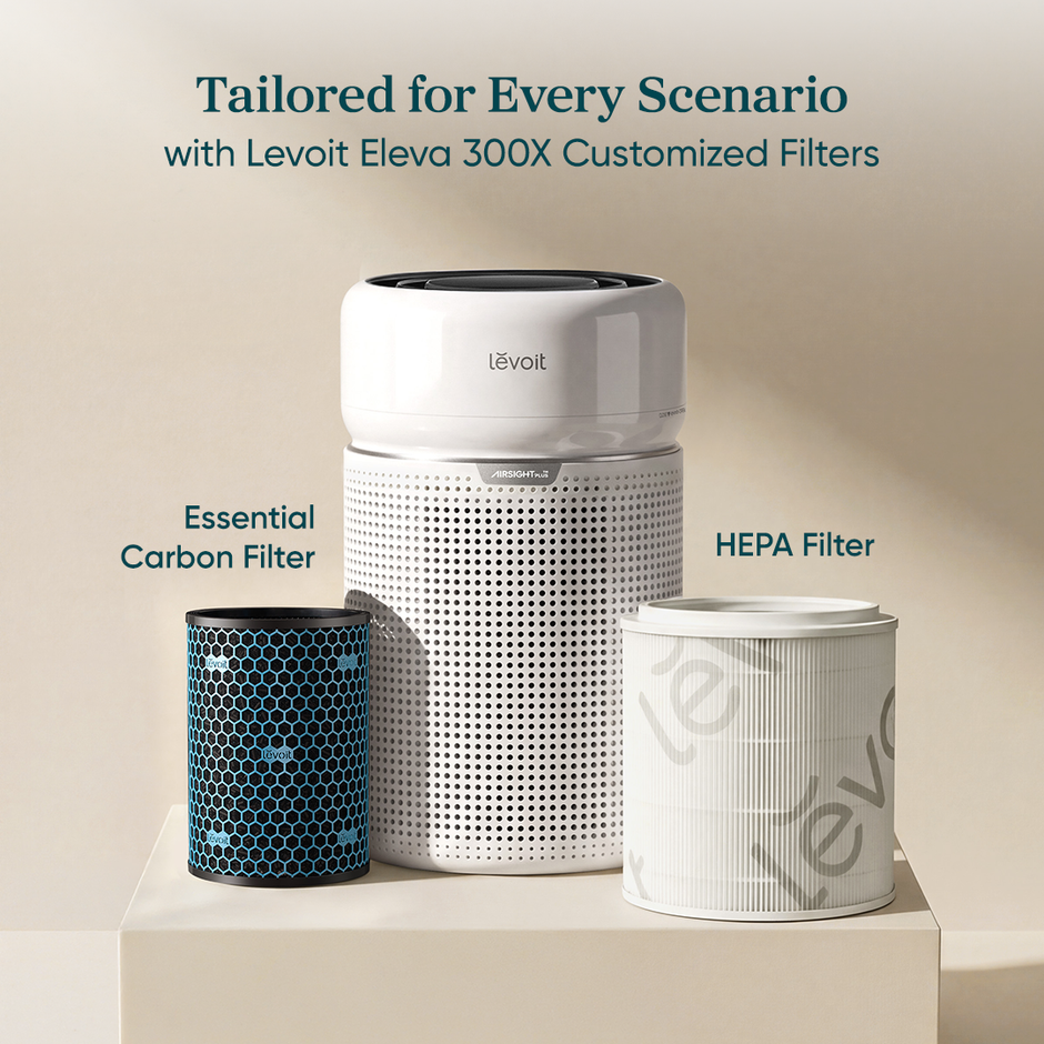 White Levoit air purifier with essential carbon and HEPA replacement filter canisters