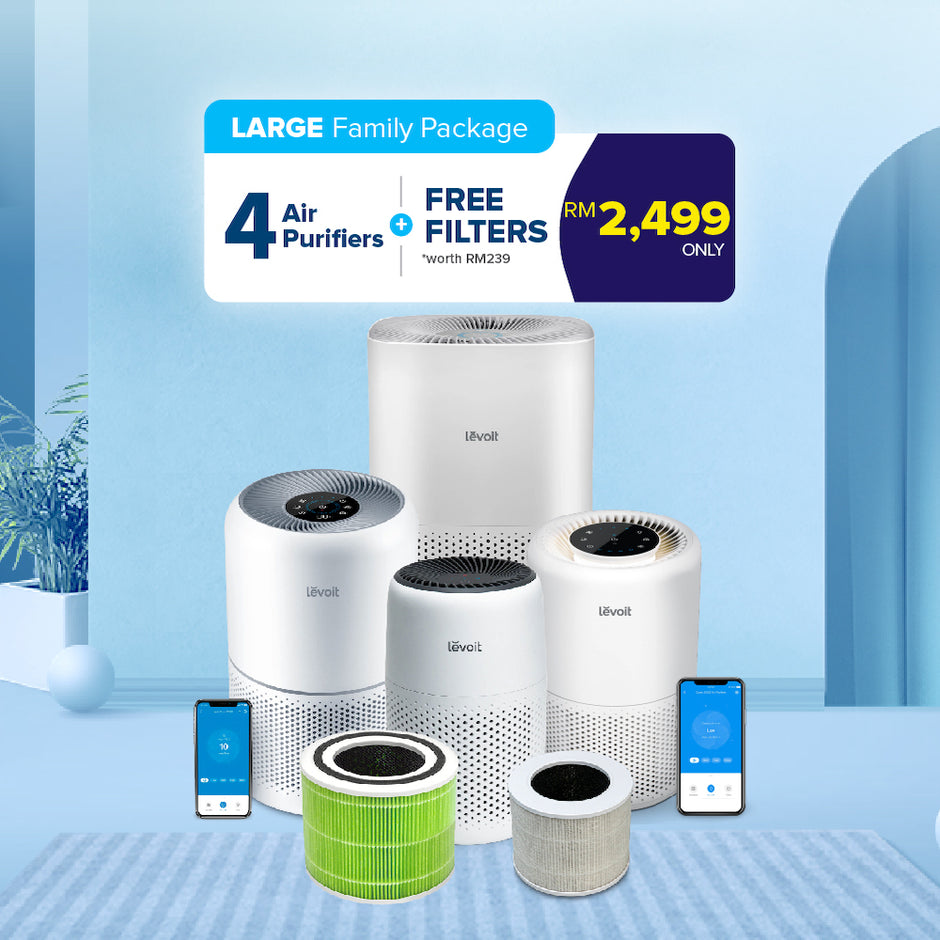 Four white Levoit air purifiers with green filter and gray filter cartridges