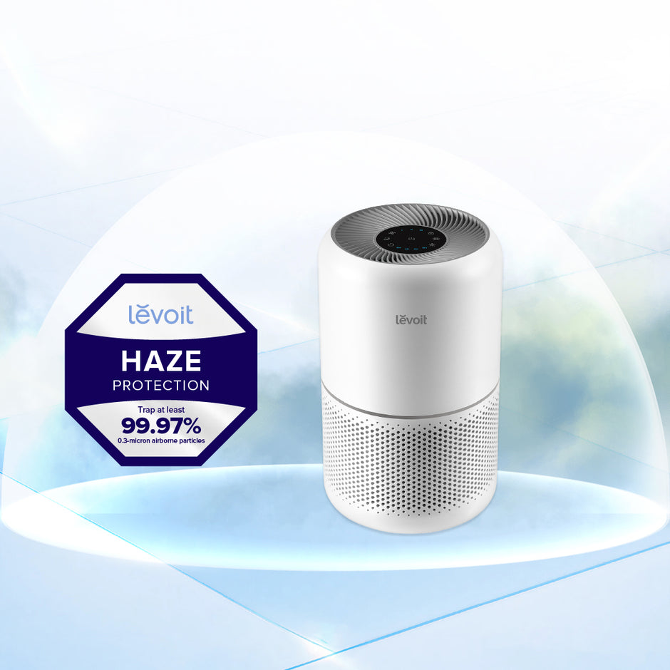 Levoit Core 300 air purifier, white cylindrical body with top control panel and grille