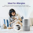 Levoit Core P350 pet air purifier on a bed with a woman holding a small pet