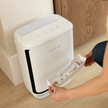 Levoit pet smart air purifier with pull-out tray containing used filter material