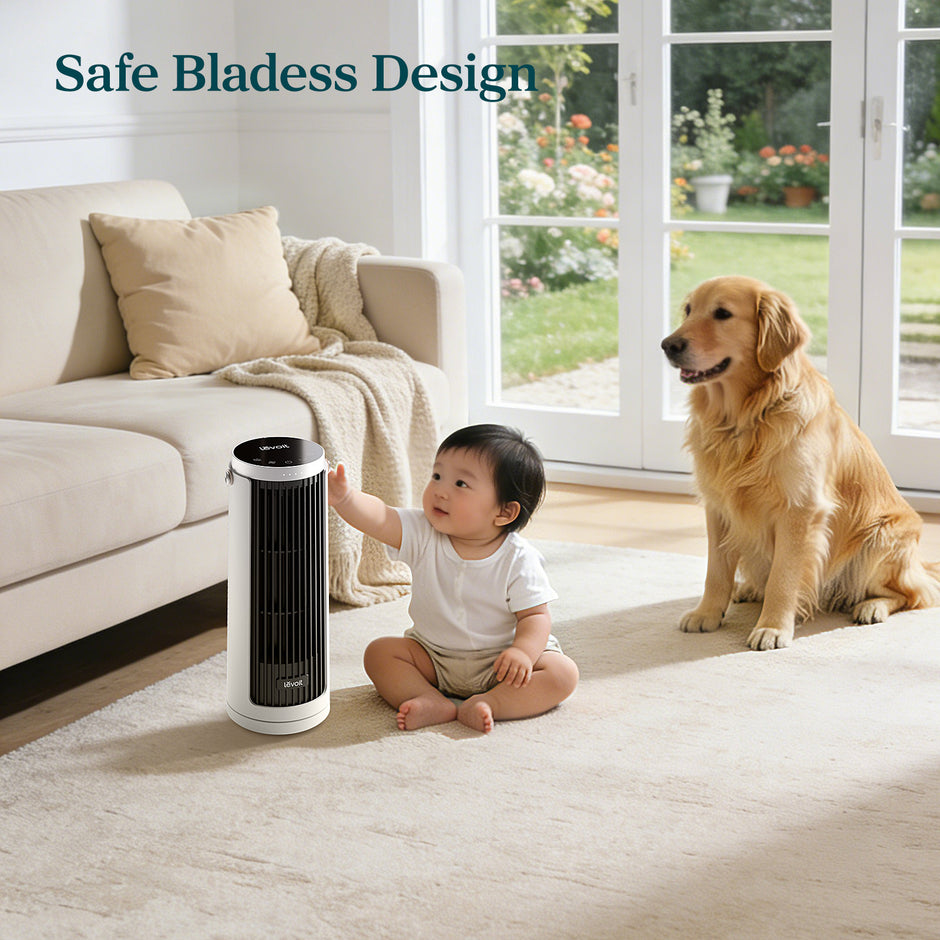 Compact white tower fan with black vertical grille standing on the floor