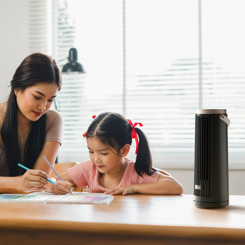 Levoit tower fan on a desk with front grille facing forward